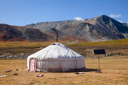 Traditional Mongolian portable round tent ger covered with white outer cover powered by solar panel...