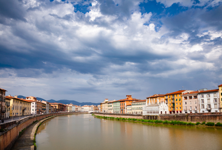 Pisa cityscape with medieval waterfront buldings and Pisan Gothic Santa Maria della Spina church on Arno River embankment, Tuscany, Italyの写真素材