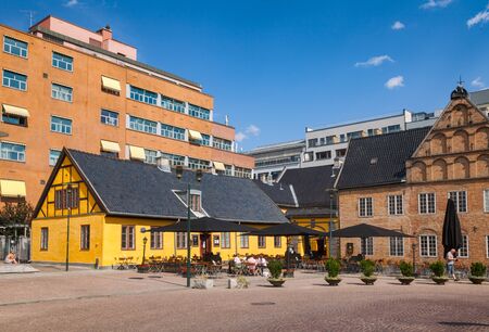 OSLO, NORWAY - JULY 12, 2018: Christiania Torv Square with sidewalk cafe and Gamle radhus (Old Town Hall) in Kvadraturen area, one of the most popular tourist attraction in Osloのeditorial素材