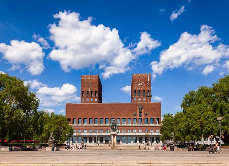 OSLO, NORWAY - JULY 12, 2018: The City Hall Square with sculptures fountains and The City Hall (Radhus) in backgroundのeditorial素材