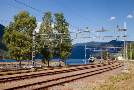 RJUKAN, NORWAY - JULY 14, 2018: Railway tracks at Mael railroad station, a part of railway ferry...