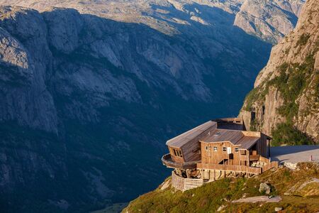 LYSEBOTN, NORWAY - AUGUST 13, 2018: Wooden building of Oygardstol panoramic restaurant overlooking Lysefjord at ÃygardstÃ¸len, a starting point of mountain trail to Kjeragboltenのeditorial素材