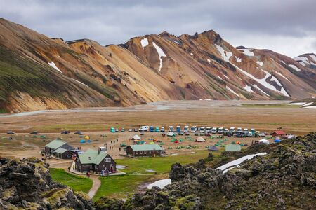Landmannalaugar, Iceland - July 24, 2015: Camping tents on a rocky campsite at the Landmannalaugar, a natural park in the Fjallabak Nature Reserve, famous for its hiking trails through stunning landscapes of volcanic terrain with colourful mountains and nのeditorial素材