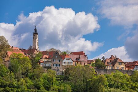 Scenic skyline of Rothenburg ob der Tauber, Bavaria, Germany, Europe, one of the most popular travel destination on Romantic Road touristic route as seen from the Tauber river valleyの写真素材
