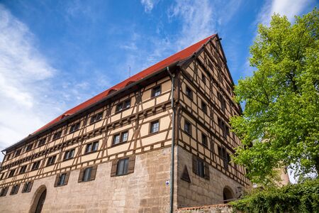 Dinkelsbuhl, Germany - May 11, 2019: Former Corn Storehouse half-timbered building built in 1508 now Youth hostelのeditorial素材