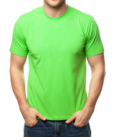 Young fit man wearing blank green shortsleeve cotton T-Shirt. Mock up template isolated on a white backgroundの写真素材