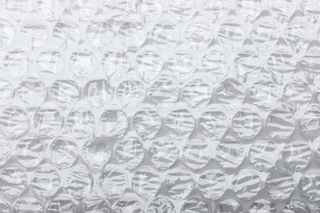 Bubble pliable transparent plastic air cushion material on white backgroundの写真素材