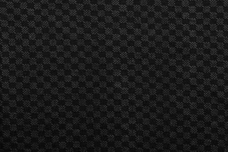 Dark grey melange knitted fabric with checkered ornament textured backgroundの写真素材