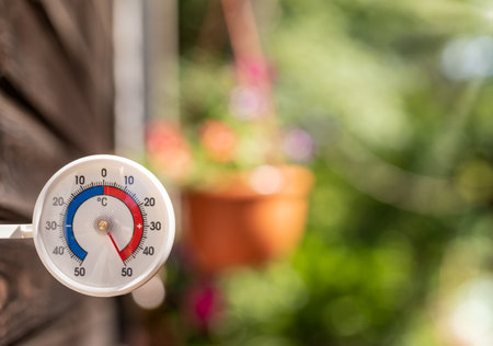 Outdoor thermometer with celsius scale shows extreme hot temperature 50 degree - summer heatwave...