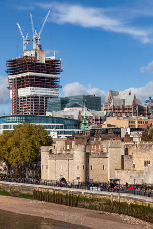 London, UK - Nov 1, 2012: The north bank of the River Thames with the Tower of London and 20 Fenchurch Street (The Walkie-Talkie) skyscraper under construction as seen from the Tower Bridgeのeditorial素材