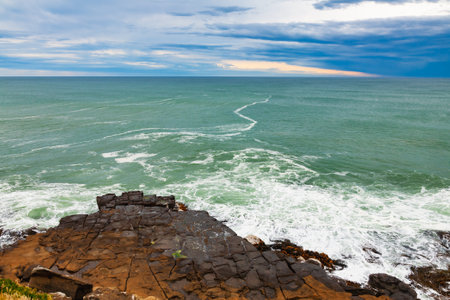 Rocky headland between Porpoise Bay and Curio Bay in Southland District of South Island, New Zealandの写真素材