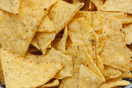 Mexican nachos or tortilla chips in a bowl close-up