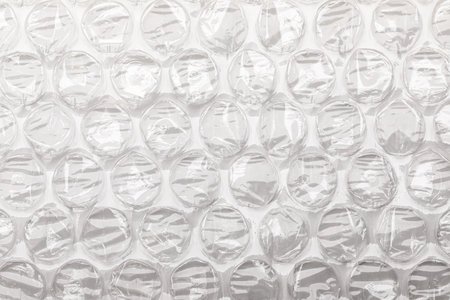 A detailed view of wrap with circular cushioned pockets designed for protecting fragile items