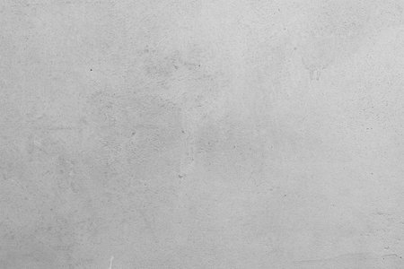 Section of a gypsum plaster wall showcasing subtle variations in texture and shade
