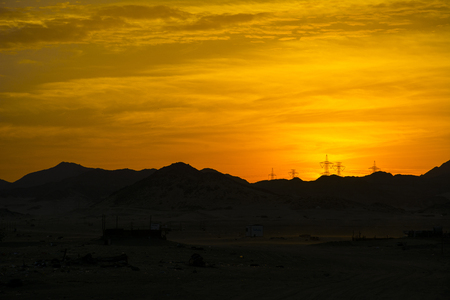 Sunrises in Saudiarabia, beautiful orange sky with mountainの写真素材