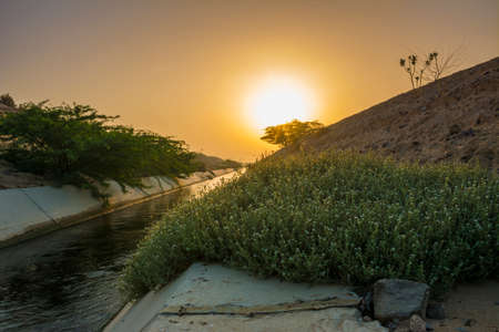 Water canal with clear sky sunrise