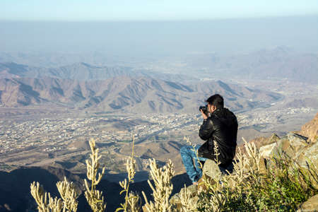 Photographer taking mountainscape at Taif, Saudi arabia