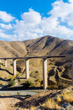 Beautiful road with bridge and mountain background, beautiful cloudy sky, Banisad, Saudi arabia