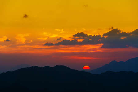 Beautiful mountain sunset with dramatic clouds, Located in Banisad, Saudi arabiaの写真素材