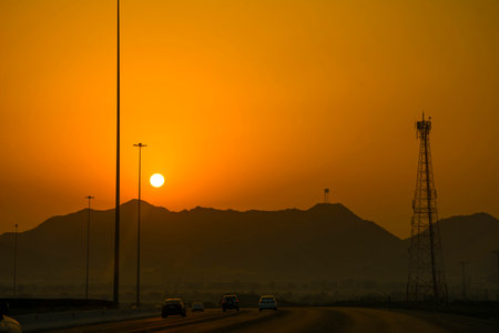 Sunrise scene in Jeddah Makkah express highway with mountain silhouetteの写真素材
