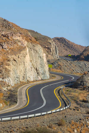 Beautiful road with mountain background, beautiful clear sky, Banisad, Saudi arabiaの写真素材