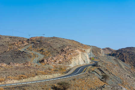 Beautiful road with mountain background, beautiful clear sky, Banisad, Saudi arabiaの写真素材