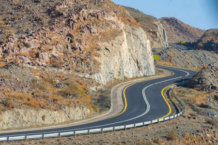Beautiful road with mountain background, beautiful clear sky, Banisad, Saudi arabiaの写真素材