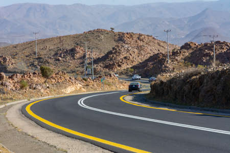 Beautiful road with mountain background, beautiful clear sky, Banisad, Saudi arabiaの写真素材