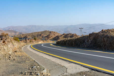Beautiful road with mountain background, beautiful clear sky, Banisad, Saudi arabiaの写真素材