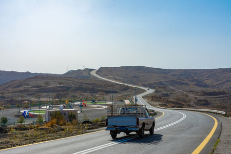 Beautiful road with mountain background, beautiful clear sky, Banisad, Saudi arabiaの写真素材
