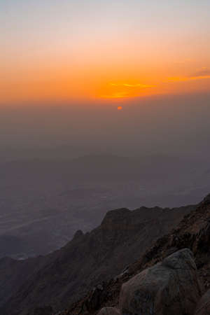 Beautiful mountain sunset with dramatic clouds, Located in Taif, Saudi arabiaの写真素材