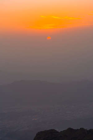 Beautiful mountain sunset with dramatic clouds, Located in Taif, Saudi arabiaの写真素材