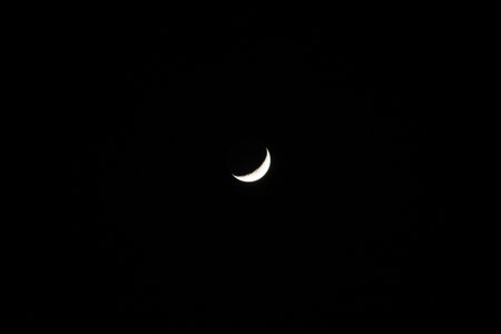 Half moon in black backgroundの写真素材