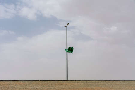 Saudi arabian national flag on Street lightの写真素材
