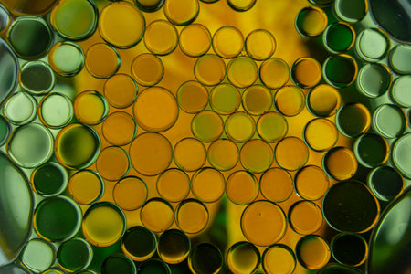 Bright and unique oil drops, circles on the water surface. Unusual background. Colorful background...