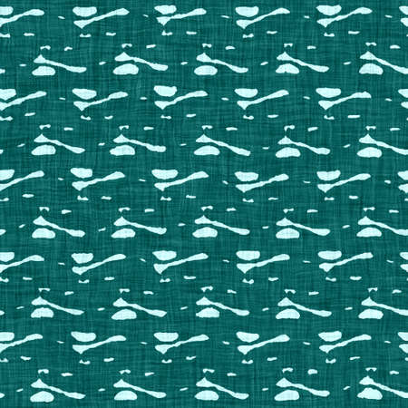 Coastal living aegean teal green broken dyed washed mottled speckle seamless pattern. Rustic marine beach house style home decor textile background. Faded blur irregular shape linen cloth fabric.の写真素材