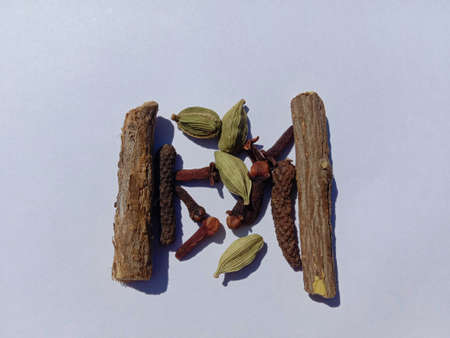 picture of mulethi (licorice) cardamom and cloves. kadha ingredients immunity booster.の写真素材