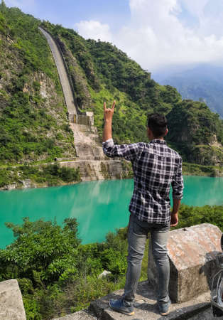 picture of boy standing and sutlej river in himachal pradesh, India.