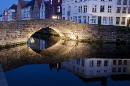 Bridge over a canal at duskの写真素材