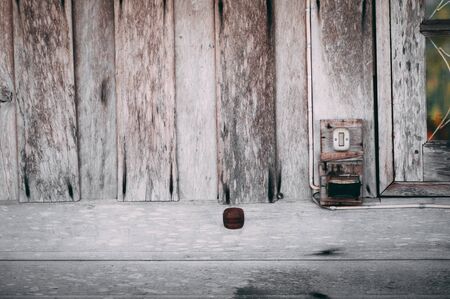 Vintage lightswitch on wooden backroundの写真素材