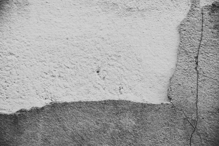 Cracked concrete brick wall backgroundの写真素材