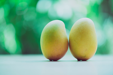 Mango on a wooden tableの写真素材