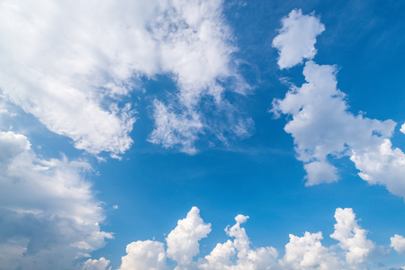 Blue sky background with cloudsの写真素材