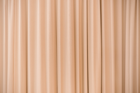 Orange curtains on background.の写真素材