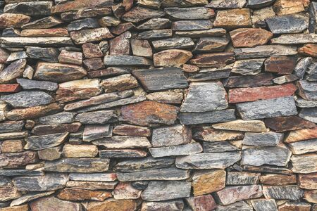 Stacked stone wall background.の写真素材