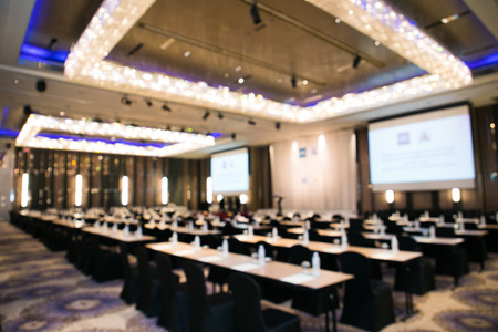 Abstract blurred photo of conference hall or seminar roomの写真素材