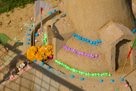 Many of paper flag put in a heap of sand to celebrate a temple Songkran Festival in Thailandの写真素材
