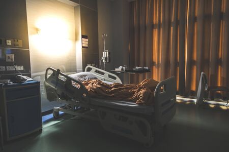 Recovery Room with beds and comfortable medical. Interior of an empty hospital room. Clean and empty room with a bed in the new medical centerの写真素材