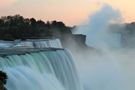 Close up of Niagara Falls in evening as seen from USA, with water flow blurredの写真素材