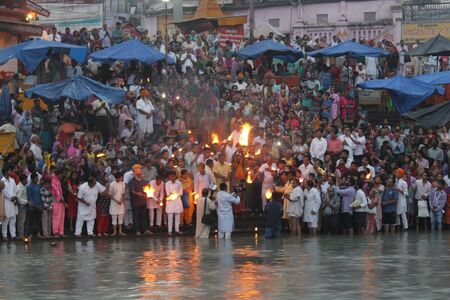 Haridwar, India - October 10 2014: Worshipers assembled early morning at dawn for Ganga Aarti at the Ganges river in Haridwarのeditorial素材